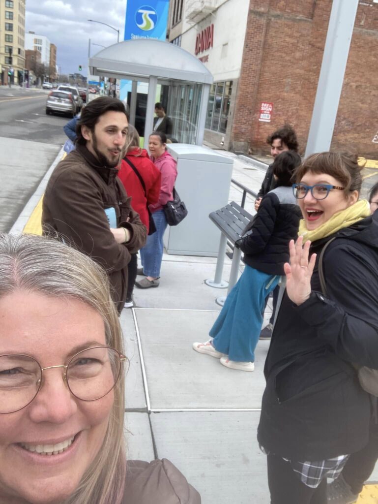 people gathered at a Spokane Transit Authority bus stop